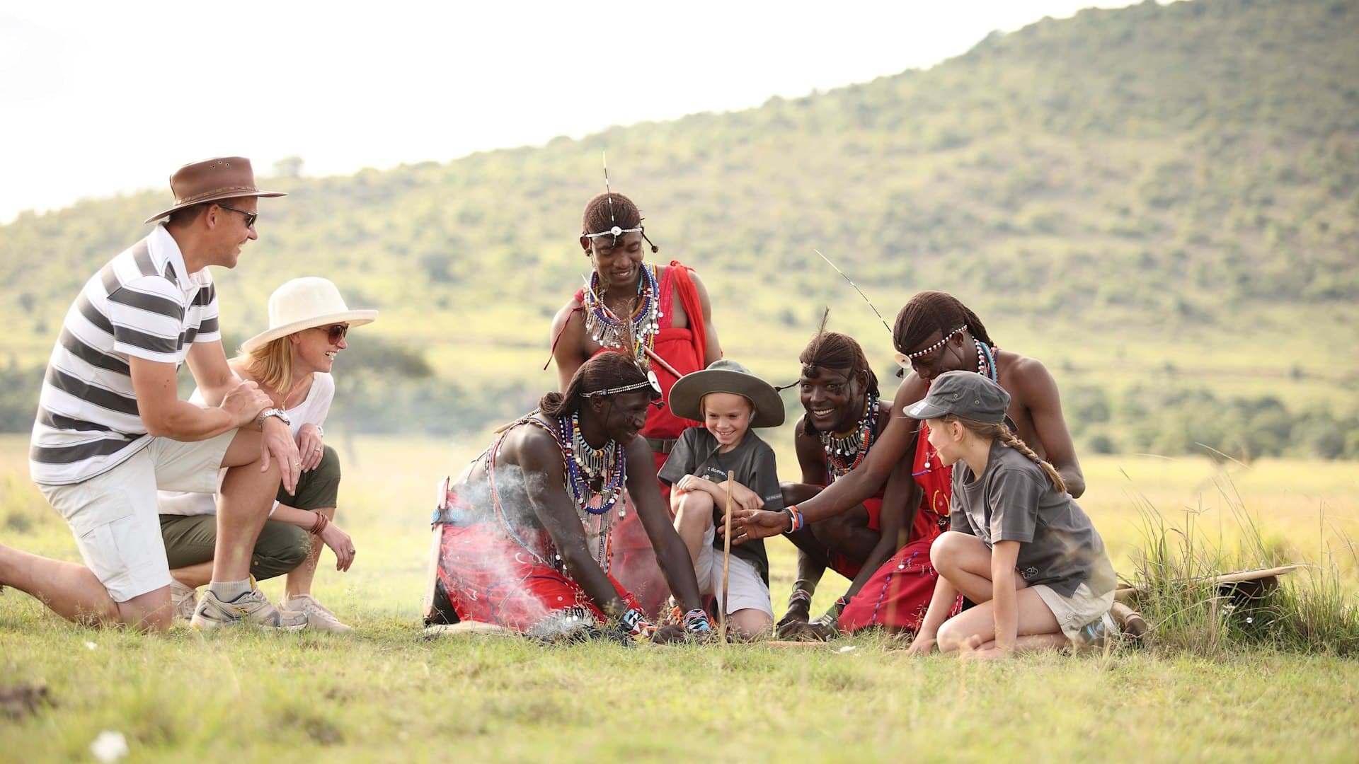 visitors interacting with maasai people